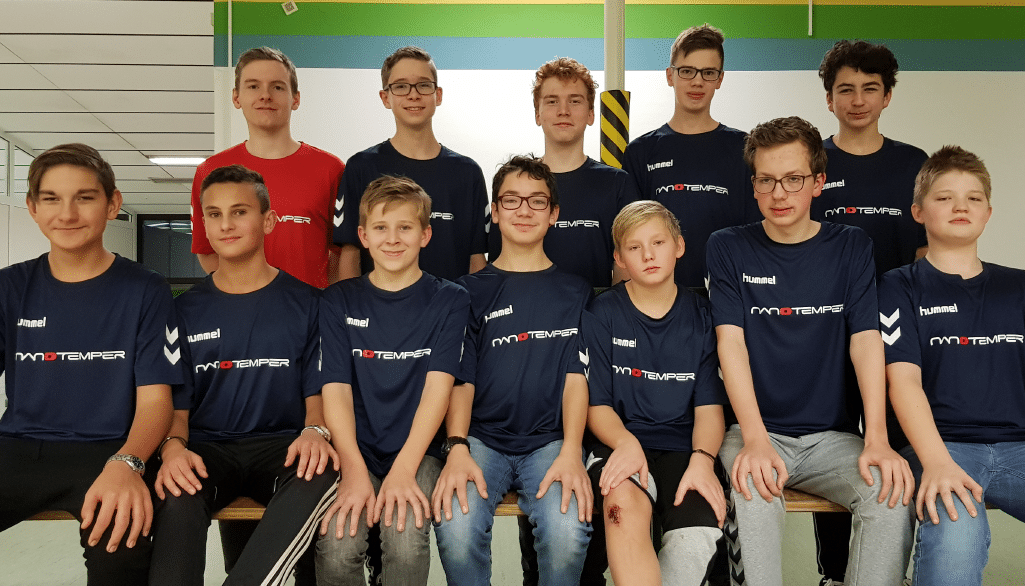 Handball team wearing NanoTemper t-shirts, smiling for photo featured image