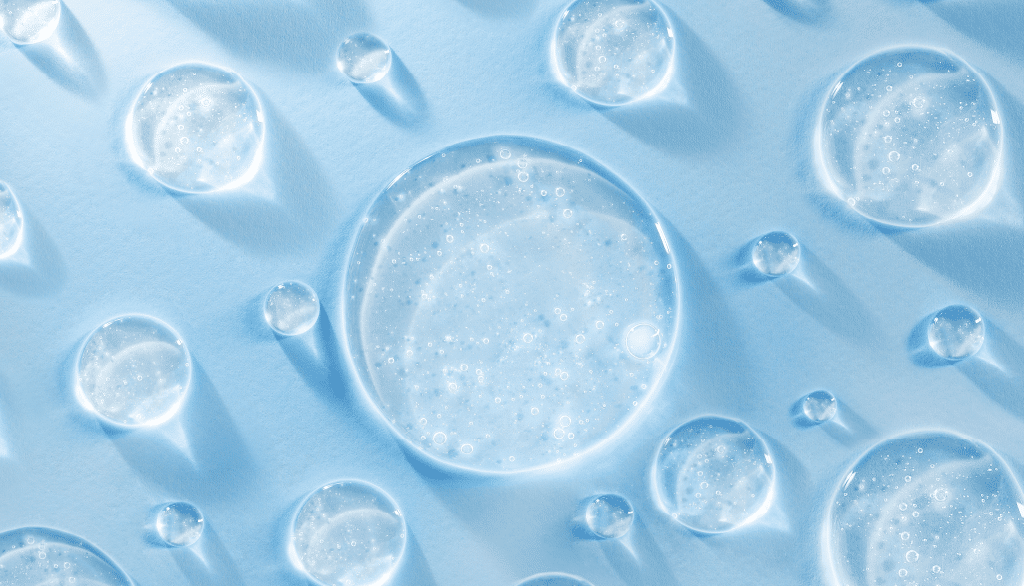 Water droplets with bubbles on blue background